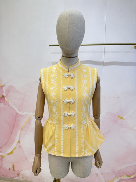 Chaleco amarillo estampado acabado peplum