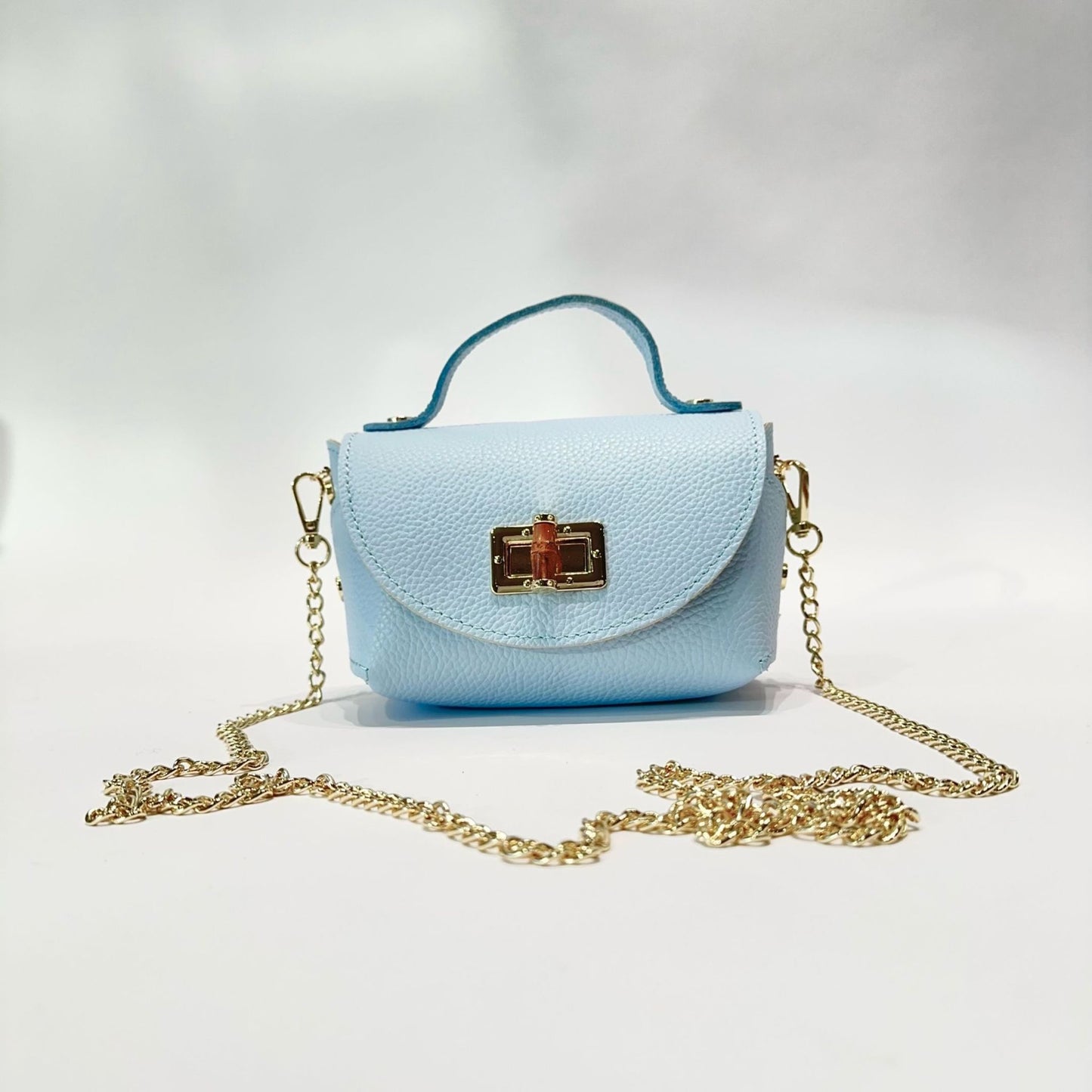 Mini Bolso de Piel con Cierre Dorado - Elegante y Compacto