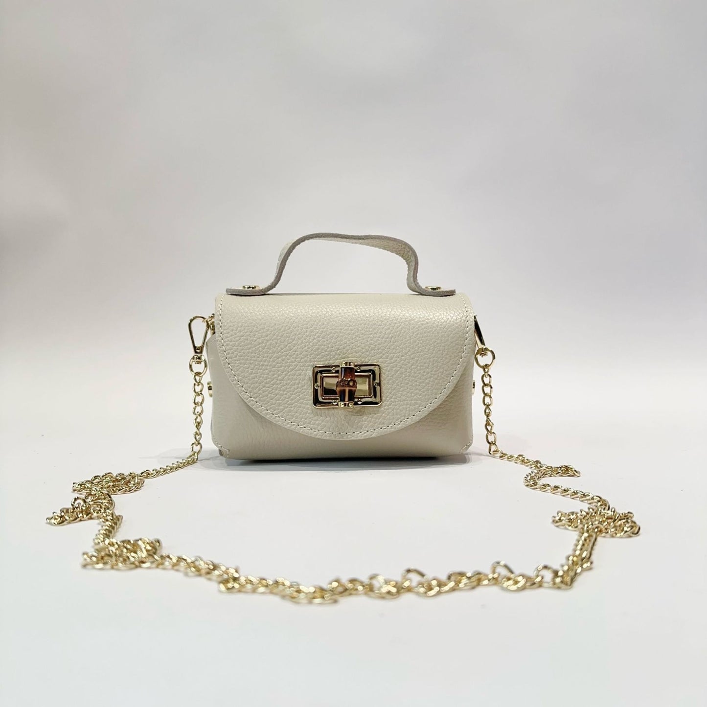 Mini Bolso de Piel con Cierre Dorado - Elegante y Compacto