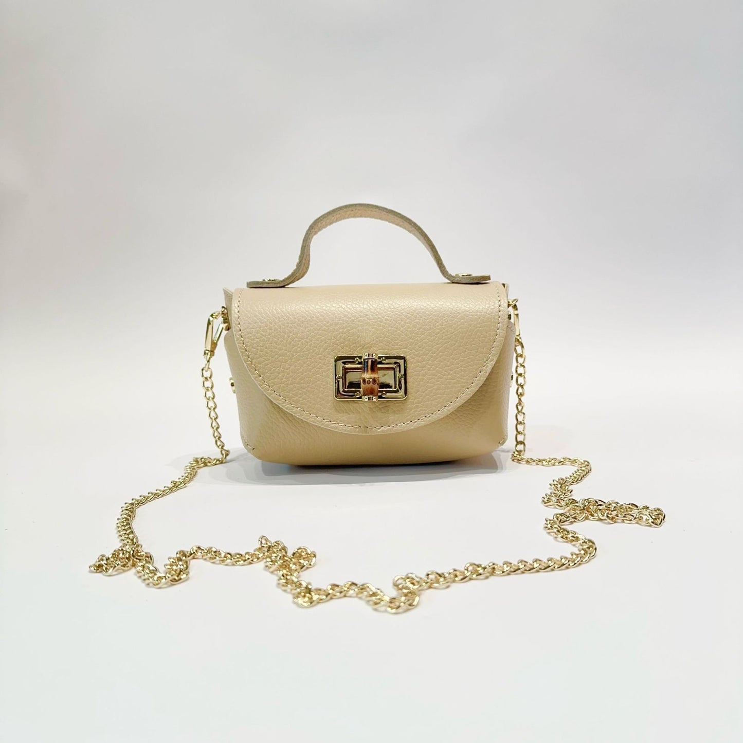 Mini Bolso de Piel con Cierre Dorado - Elegante y Compacto